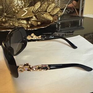 Stylish Black Sunglasses with Gold Accents